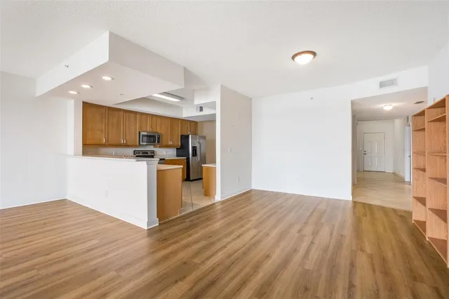 a view of a kitchen with wooden floor
