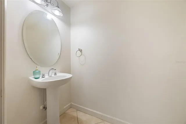 a bathroom with a sink and mirror