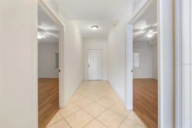 a view of hallway with wooden floor