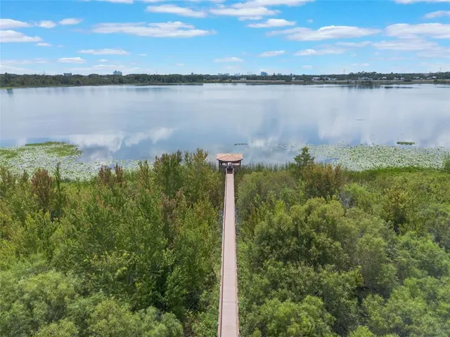 a view of a lake with houses in the back