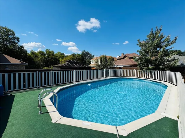 a view of a swimming pool with a garden