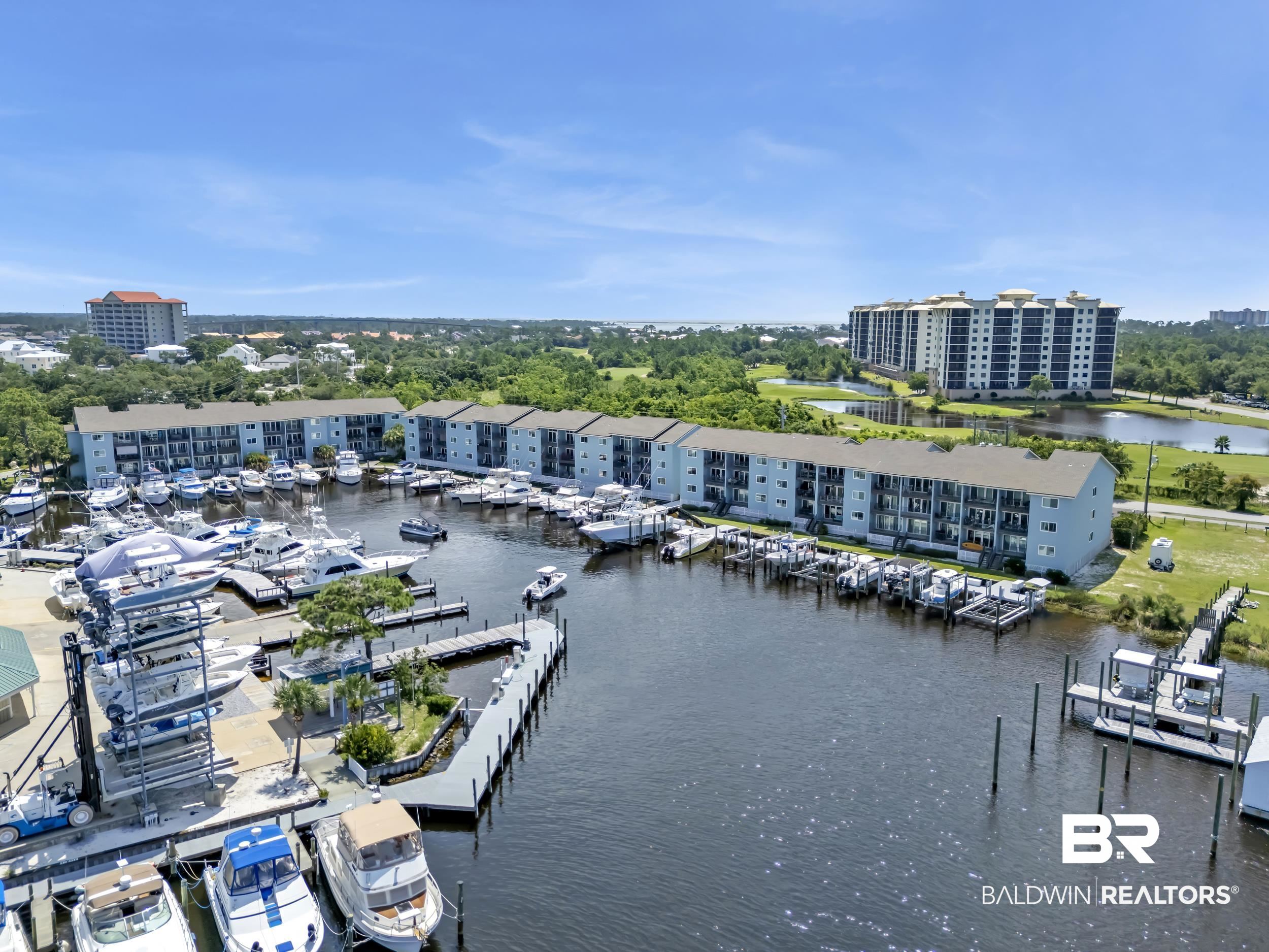14100 River Road, Unit 211 Pensacola, FL 32507 - Photo 40 of 56 Marina with multiple boat slips, boat lifts, and direct water access