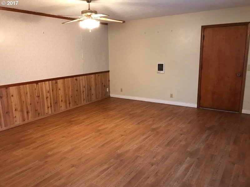 19495 Southeast Chambers Road Sandy, OR 97055 - Photo 20 of 32 a view of an empty room with wooden floor
