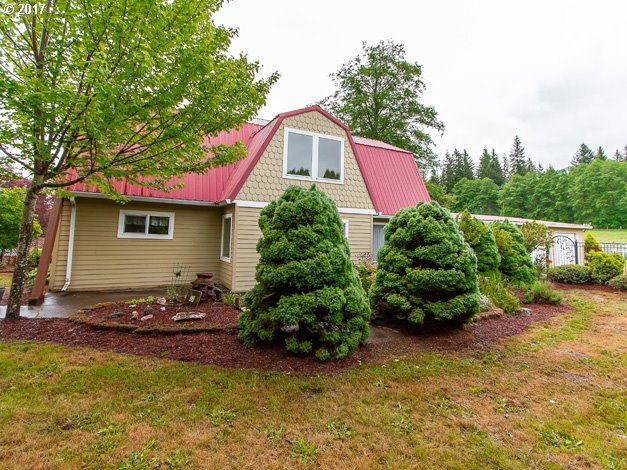 19495 Southeast Chambers Road Sandy, OR 97055 - Photo 26 of 32 a view of a house with pool and a garden