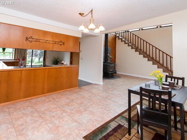 19495 Southeast Chambers Road Sandy, OR 97055 - Photo 5 of 32 a view of a dining room with furniture and a chandelier