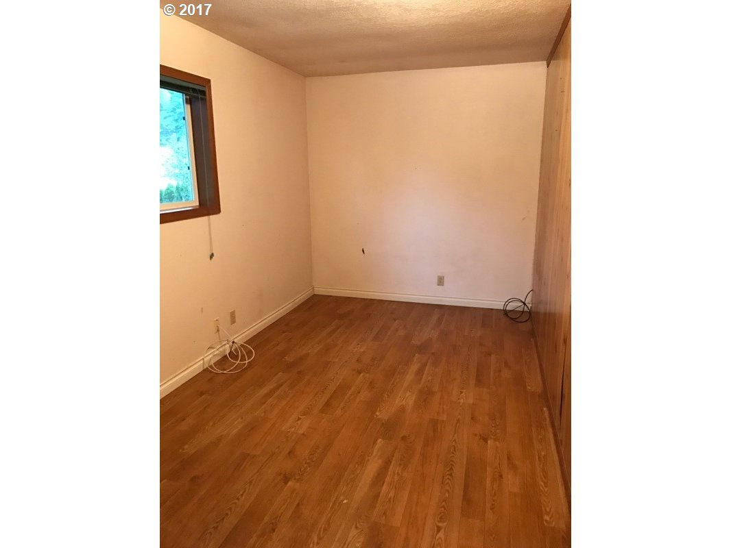19495 Southeast Chambers Road Sandy, OR 97055 - Photo 10 of 32 a view of a room with wooden floor and a window