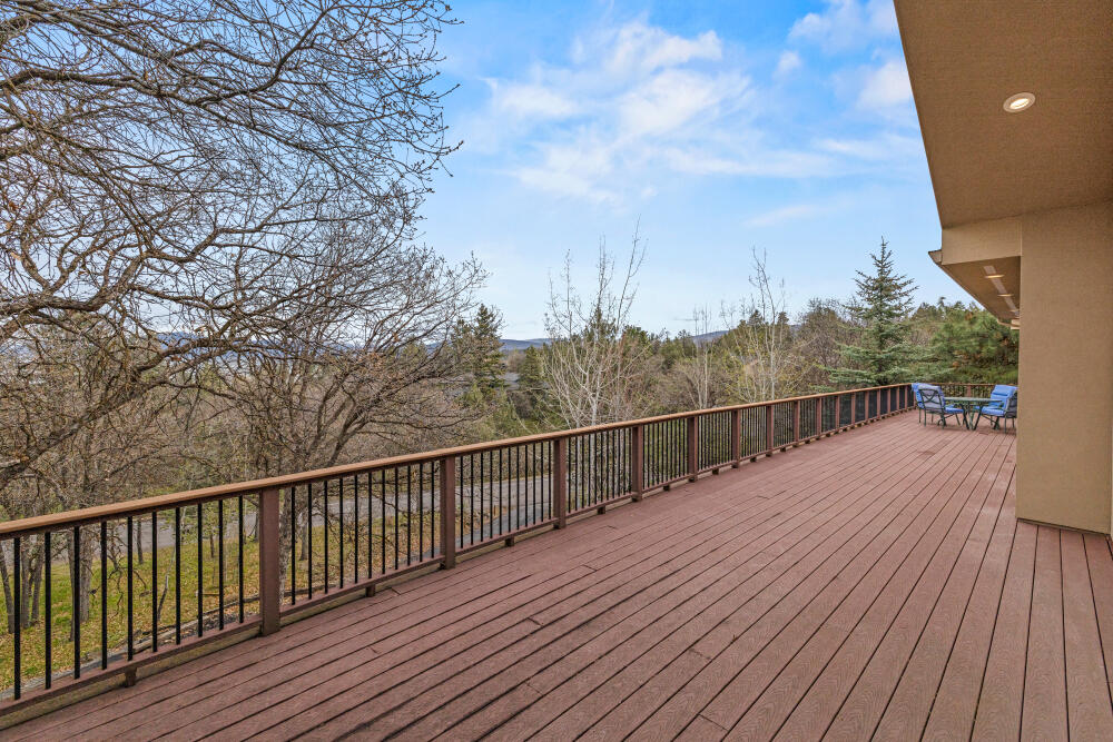 6586 Cooper's Hawk Road Klamath Falls, OR 97601 - Photo 61 of 68 a view of balcony with wooden floor and fence