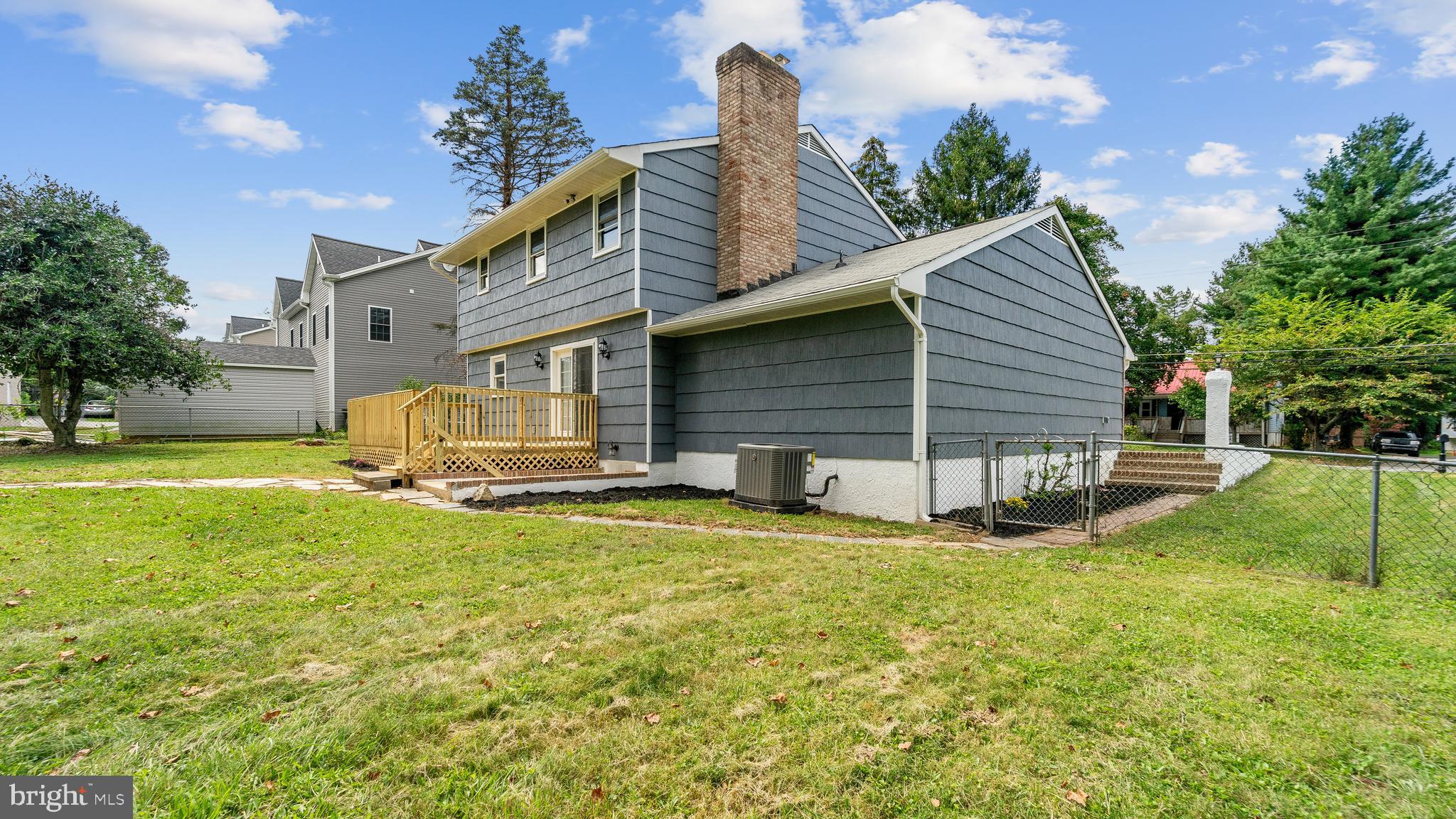 3605 Chapman Road Randallstown, MD 21133 - Photo 63 of 65 a view of a house with backyard and a tree
