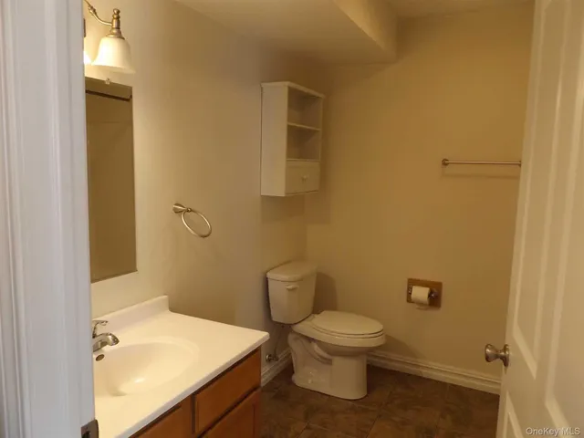 a bathroom with a sink and toilet