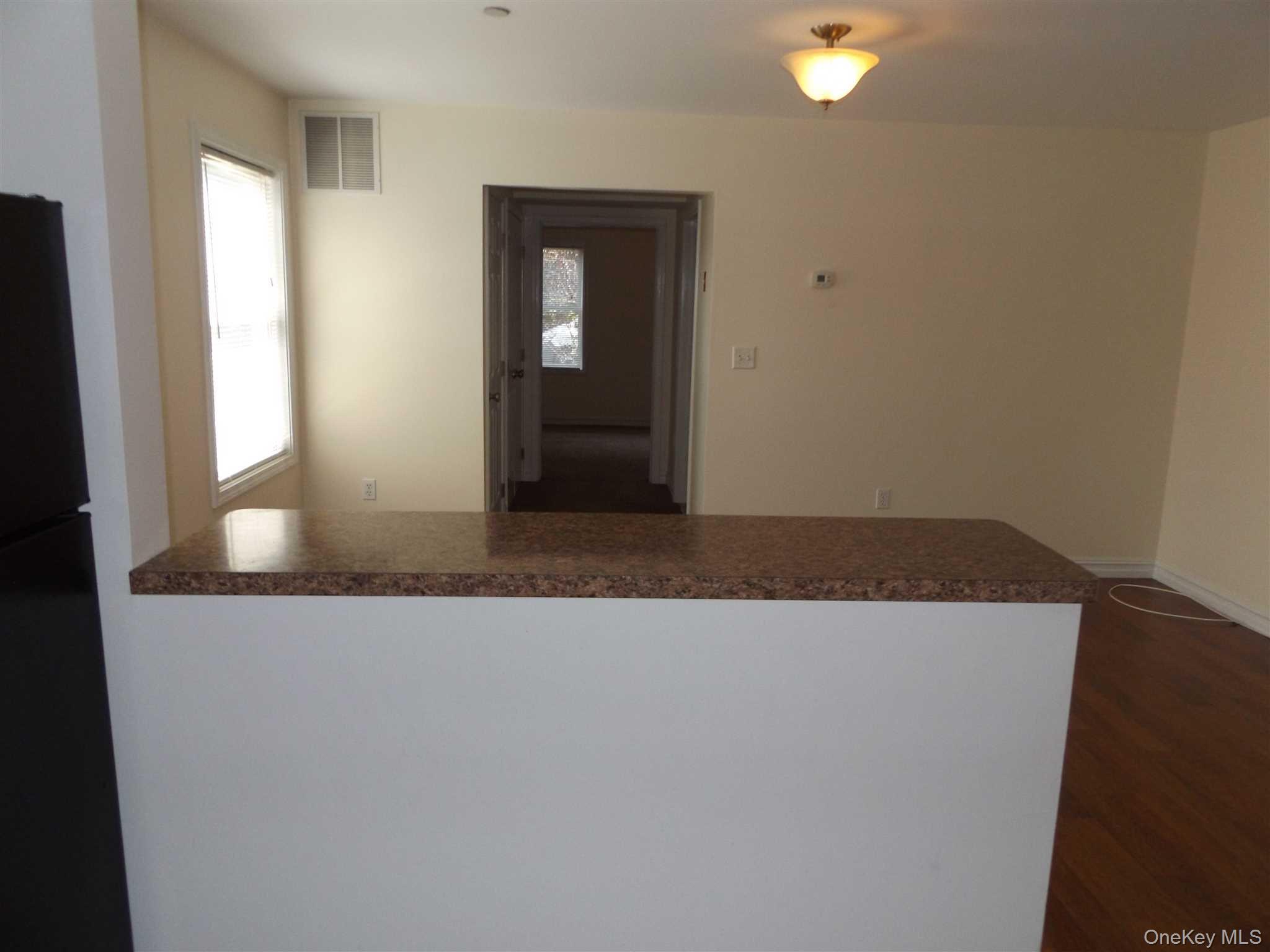 4 State Street, Unit 1 Beacon, NY 12508 - Photo 15 of 17 an empty room with windows