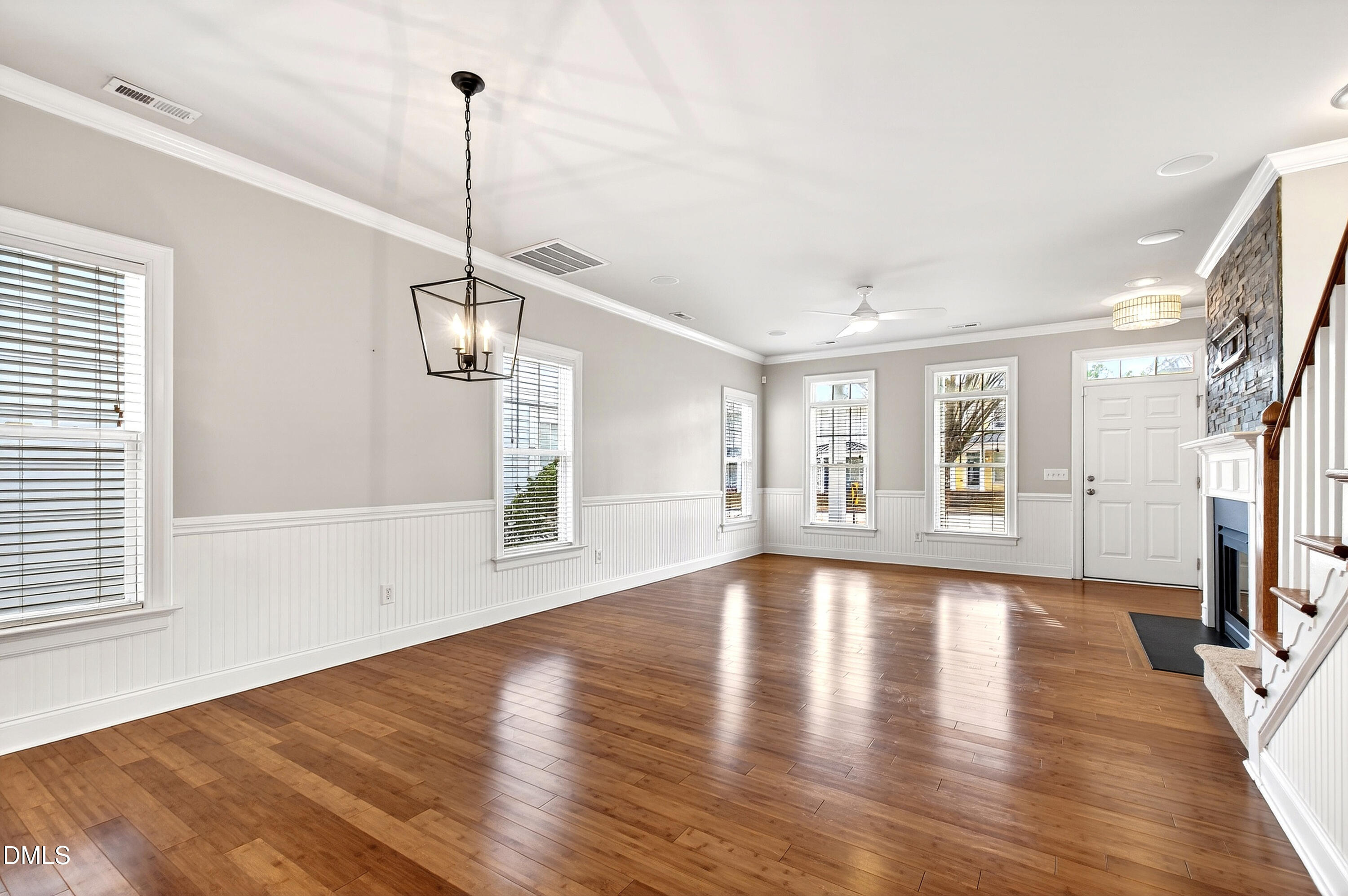 7756 ACC Boulevard Raleigh, NC 27617 - Photo 12 of 40 a view of an empty room with wooden floor and a window