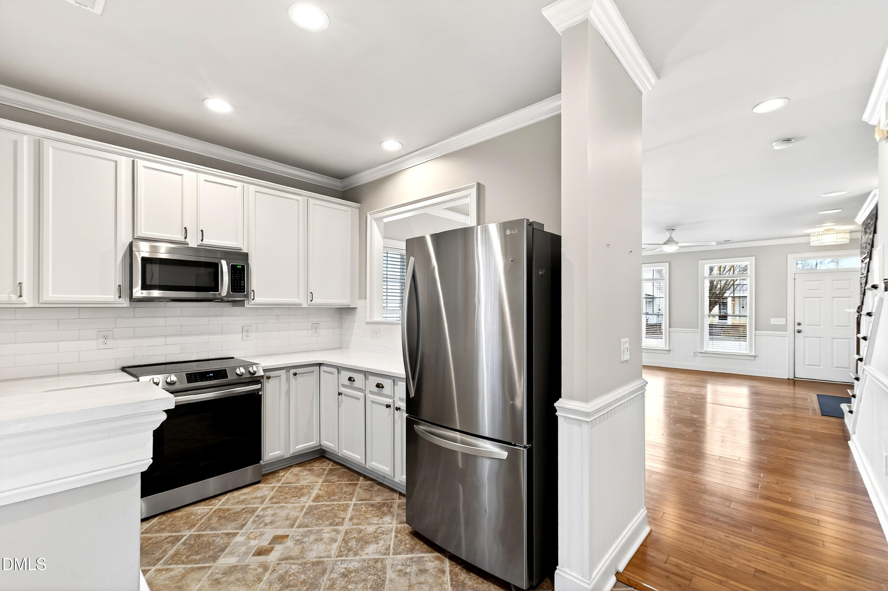 7756 ACC Boulevard Raleigh, NC 27617 - Photo 13 of 40 a kitchen with stainless steel appliances granite countertop a refrigerator a stove top oven a sink and dishwasher