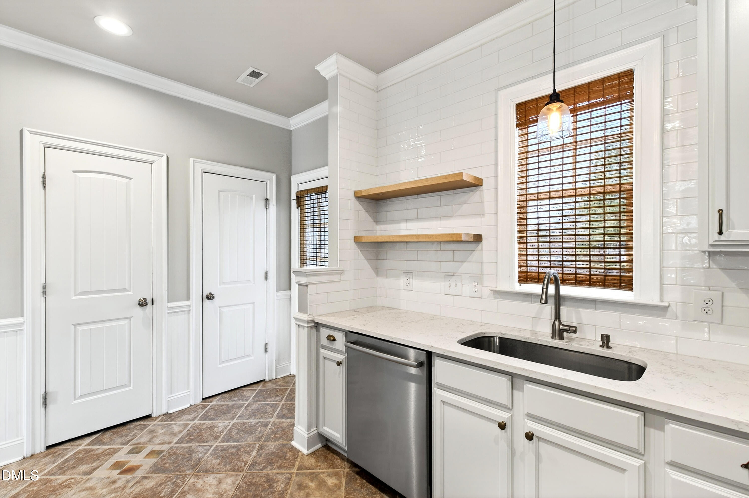 7756 ACC Boulevard Raleigh, NC 27617 - Photo 16 of 40 a kitchen with a sink and cabinets