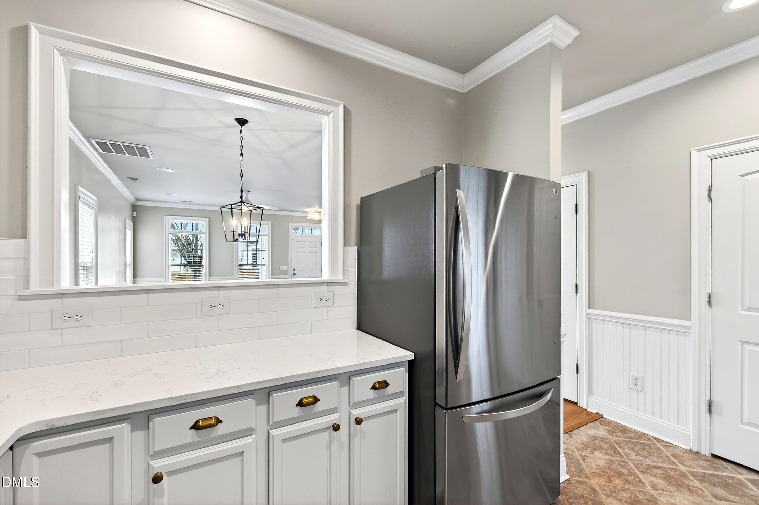7756 ACC Boulevard Raleigh, NC 27617 - Photo 17 of 40 a kitchen with stainless steel appliances a refrigerator and a sink