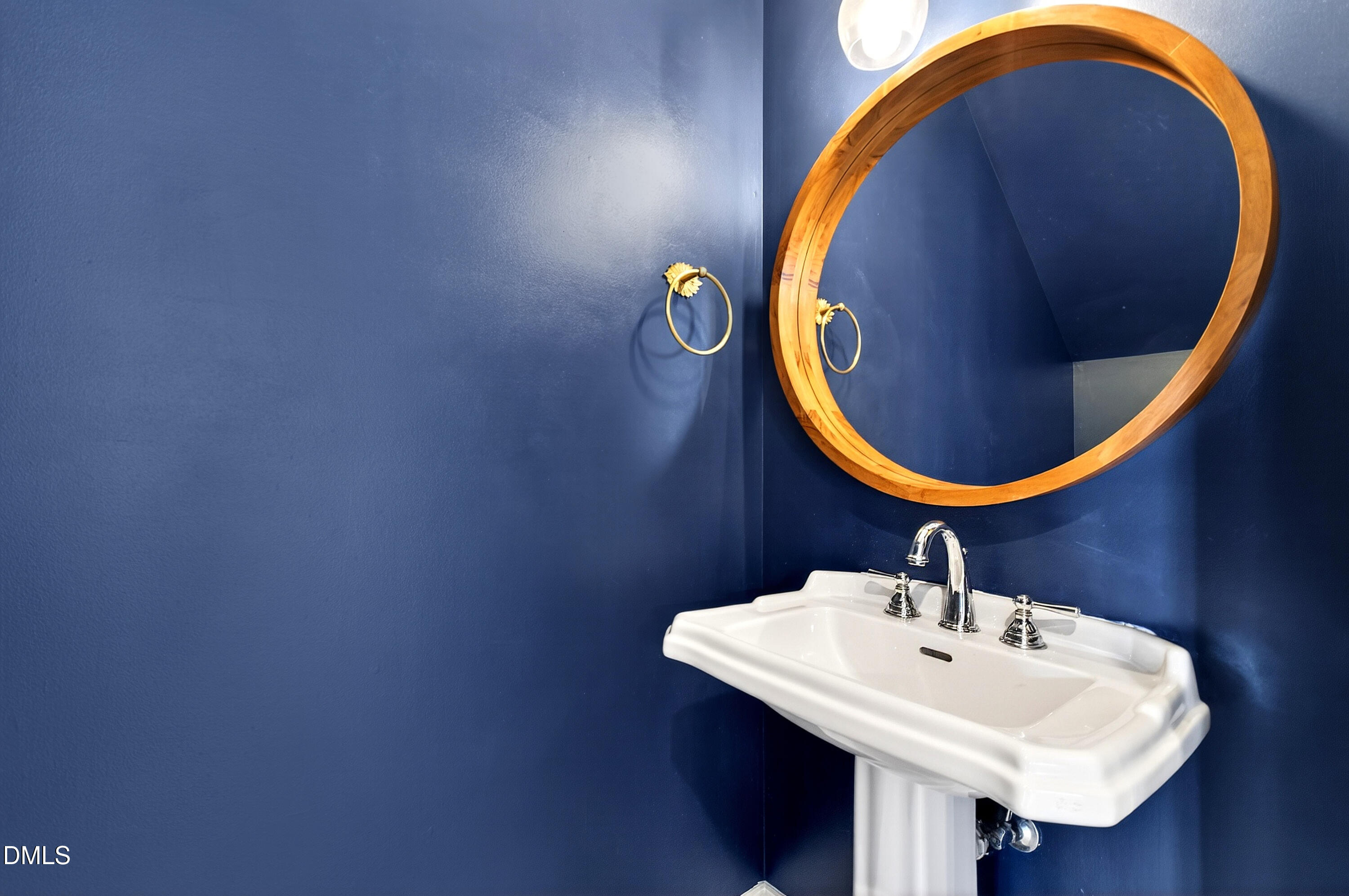 7756 ACC Boulevard Raleigh, NC 27617 - Photo 18 of 40 a bathroom with a sink and a mirror