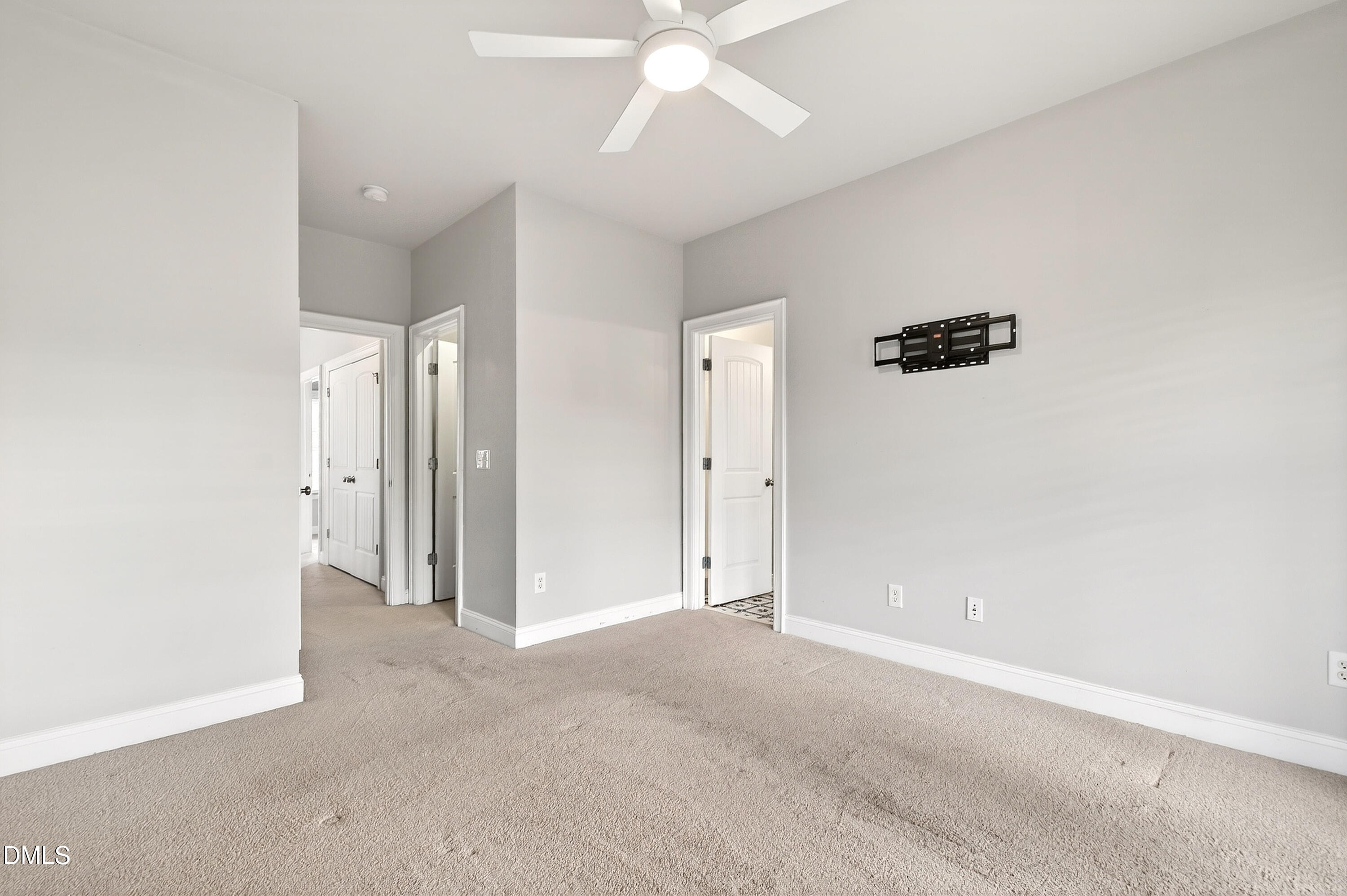 7756 ACC Boulevard Raleigh, NC 27617 - Photo 22 of 40 an empty room with a ceiling fan and a window