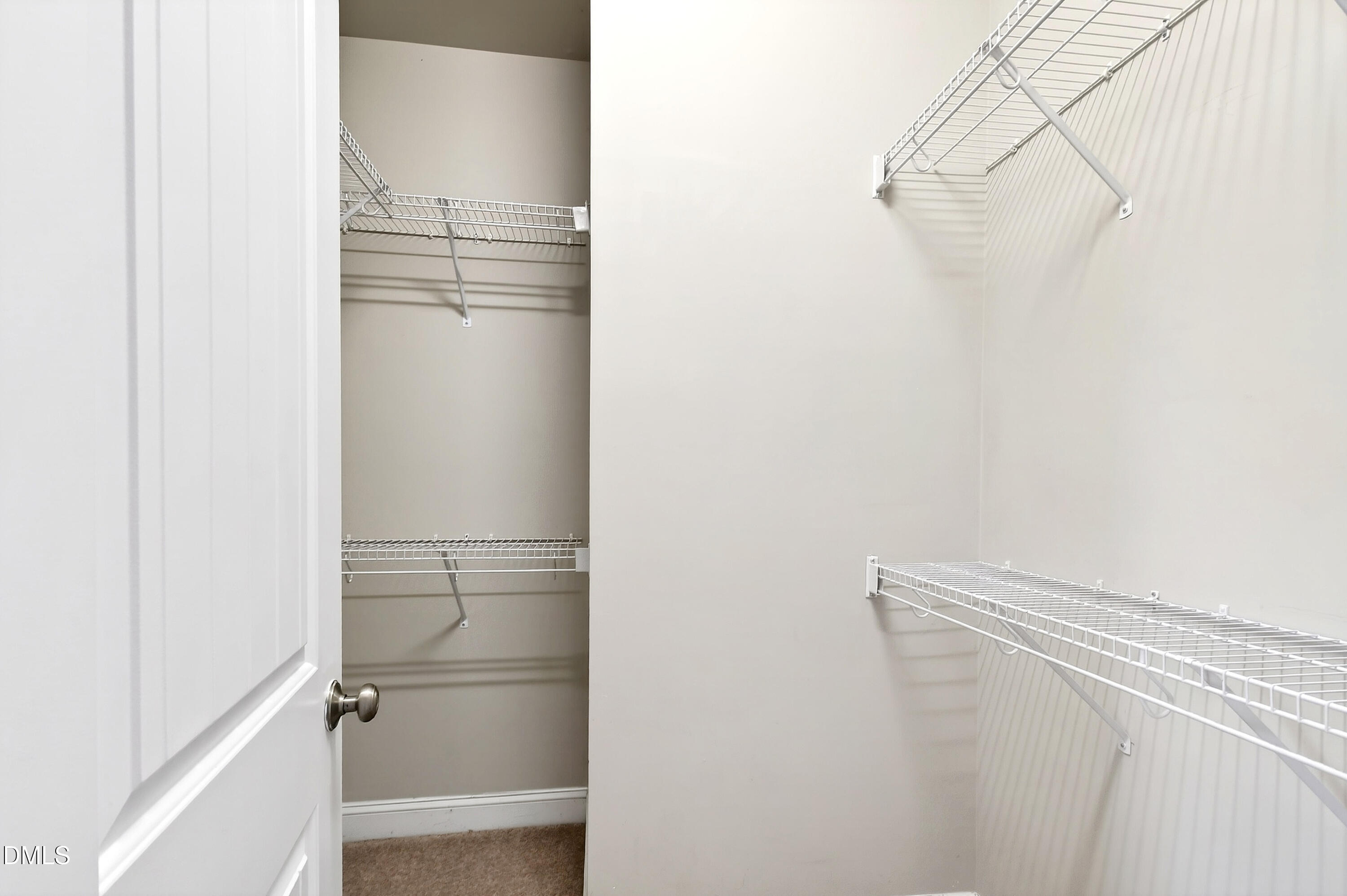 7756 ACC Boulevard Raleigh, NC 27617 - Photo 23 of 40 a view of walk in closet with empty racks