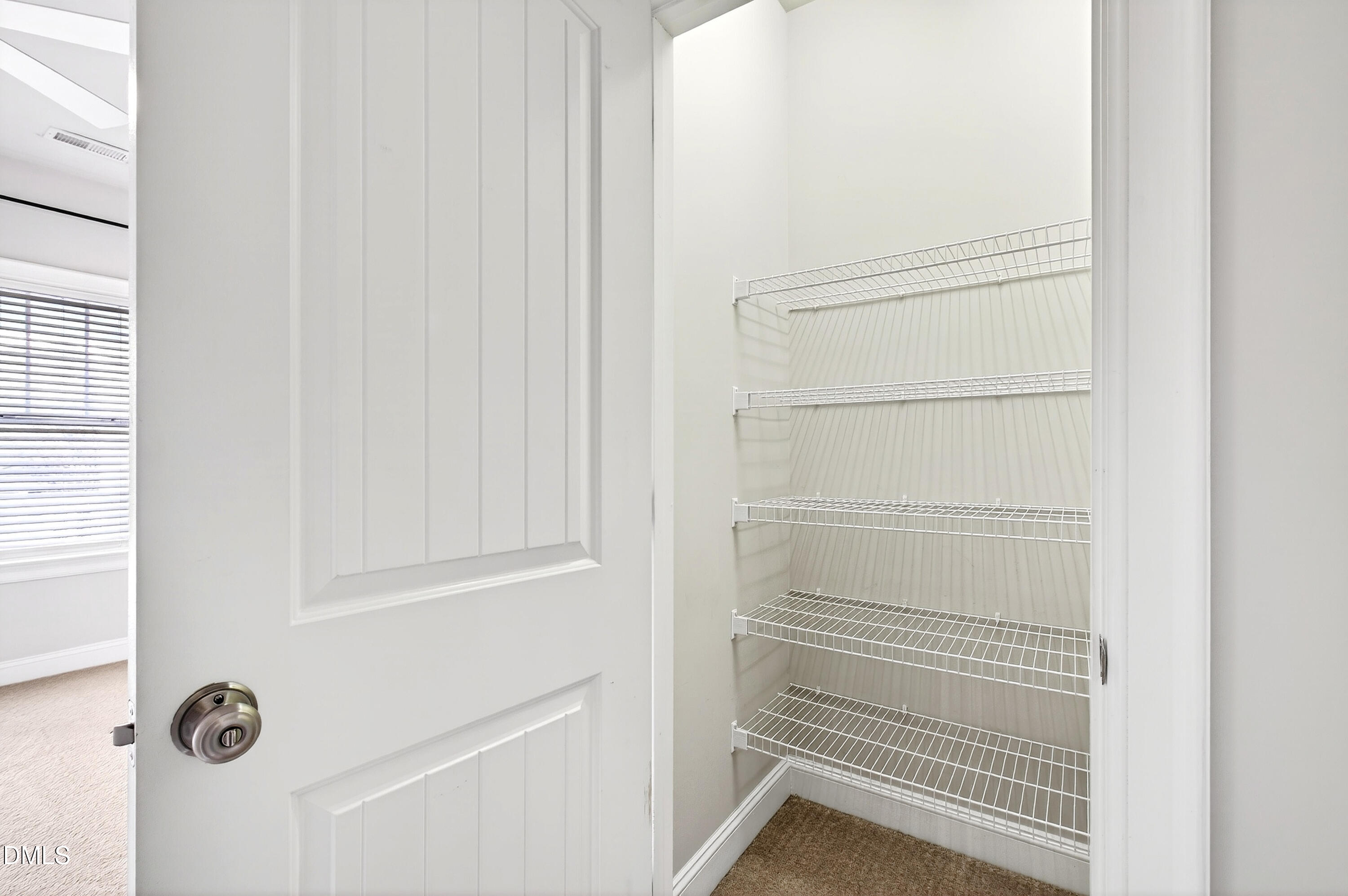 7756 ACC Boulevard Raleigh, NC 27617 - Photo 24 of 40 a view of a room with racks on the wall