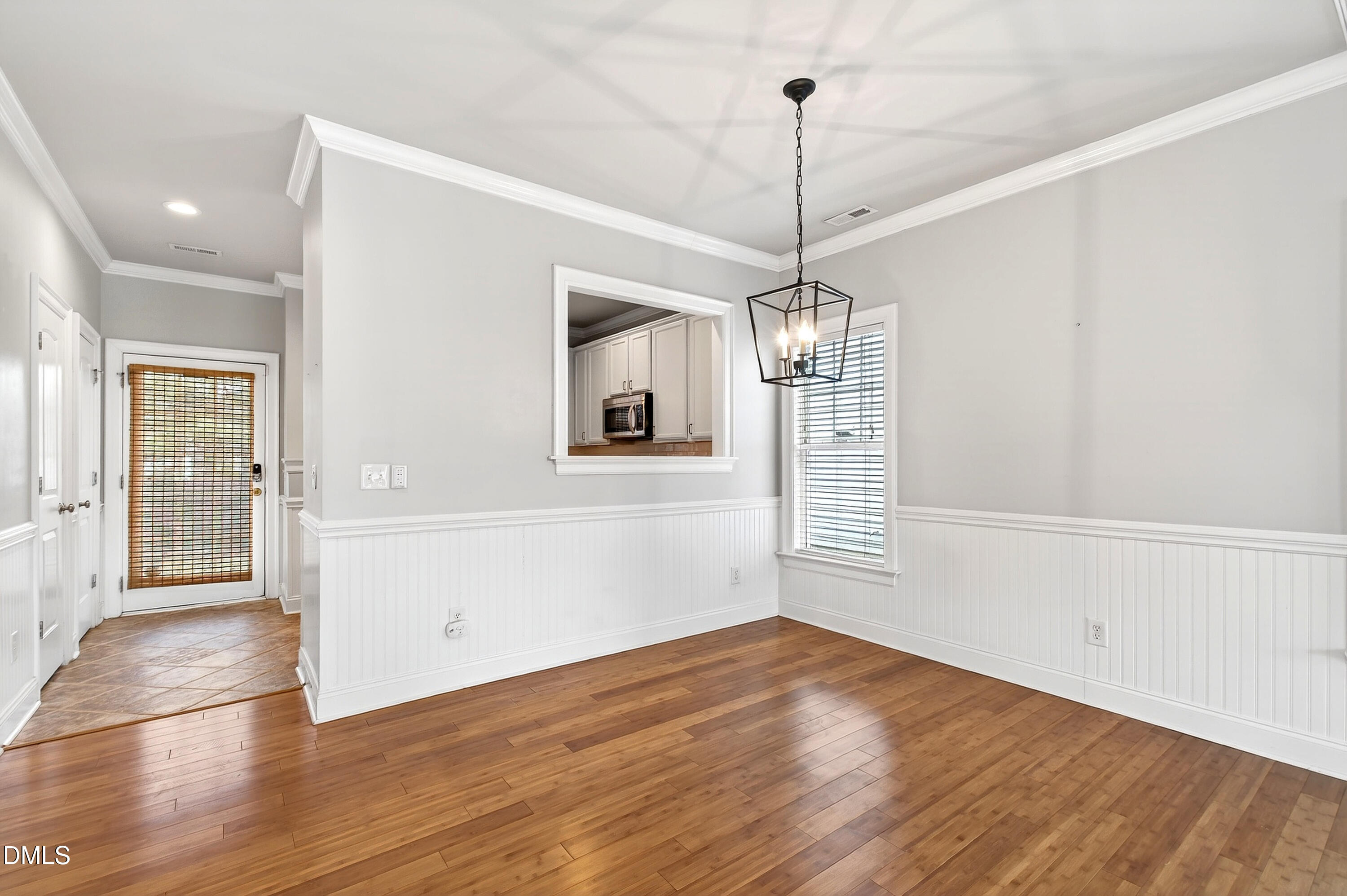 7756 ACC Boulevard Raleigh, NC 27617 - Photo 10 of 40 a view of empty room with wooden floor and window