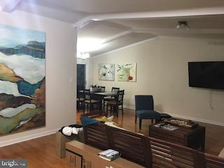 2312 Whitetail Court Reston, VA 20191 - Photo 5 of 26 a living room with furniture and a flat screen tv