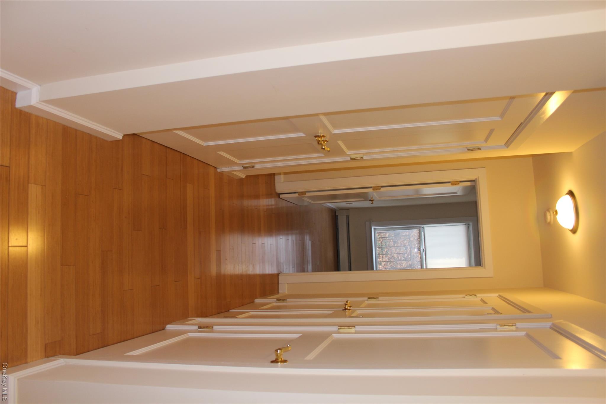 85 Bronx River Road, Unit 3S Yonkers, NY 10704 - Photo 13 of 27 Hall featuring light wood-type flooring and a baseboard heating unit