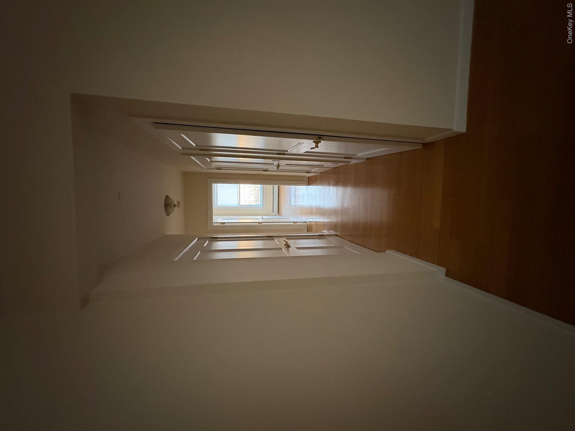 85 Bronx River Road, Unit 3S Yonkers, NY 10704 - Photo 14 of 27 Hallway with many closets and hardwood finished floors