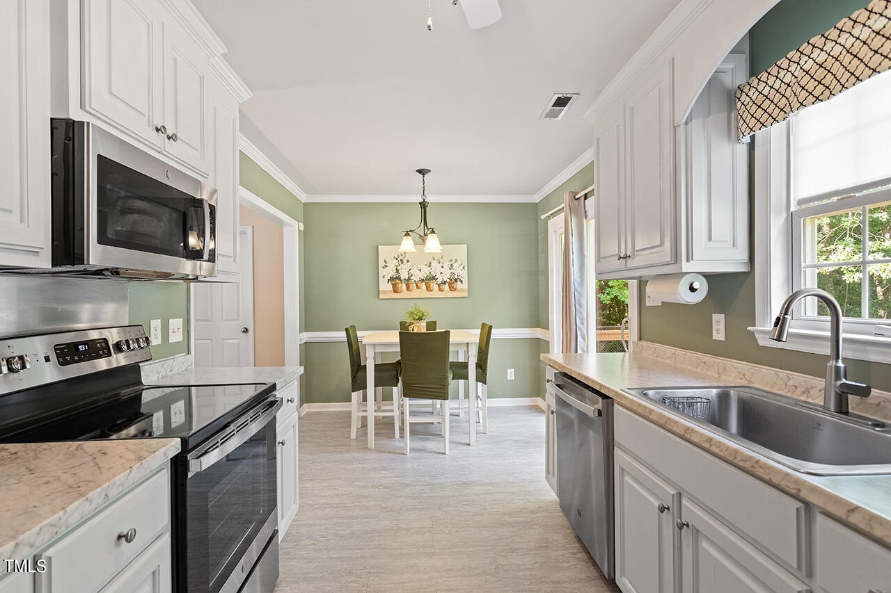 2001 Eagle View Drive Wendell, NC 27591 - Photo 19 of 33 a kitchen with a sink cabinets and window