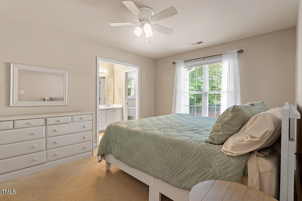 2001 Eagle View Drive Wendell, NC 27591 - Photo 21 of 33 a bedroom with a bed and window with chair