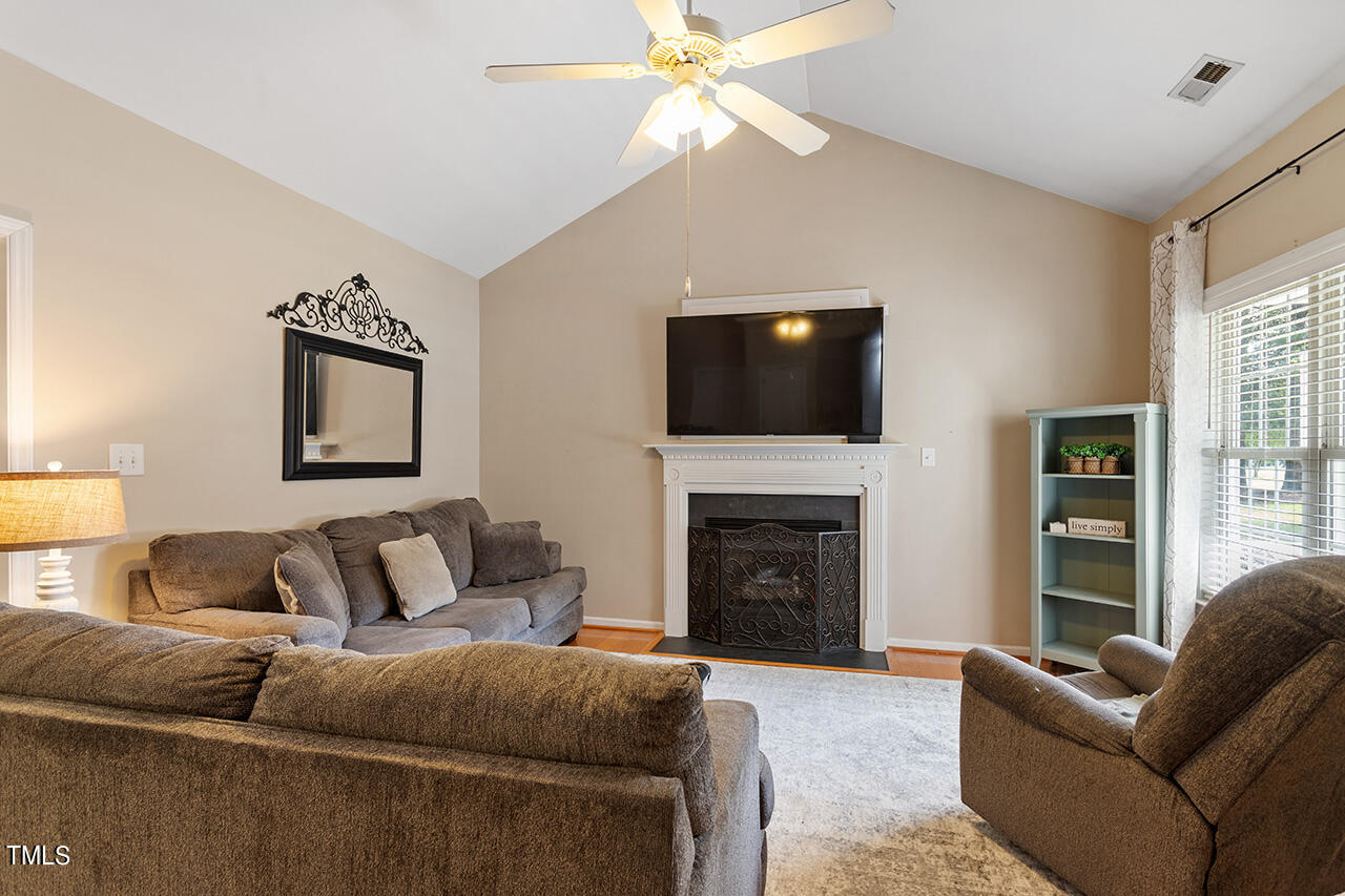 2001 Eagle View Drive Wendell, NC 27591 - Photo 9 of 33 a living room with furniture a fireplace and a flat screen tv