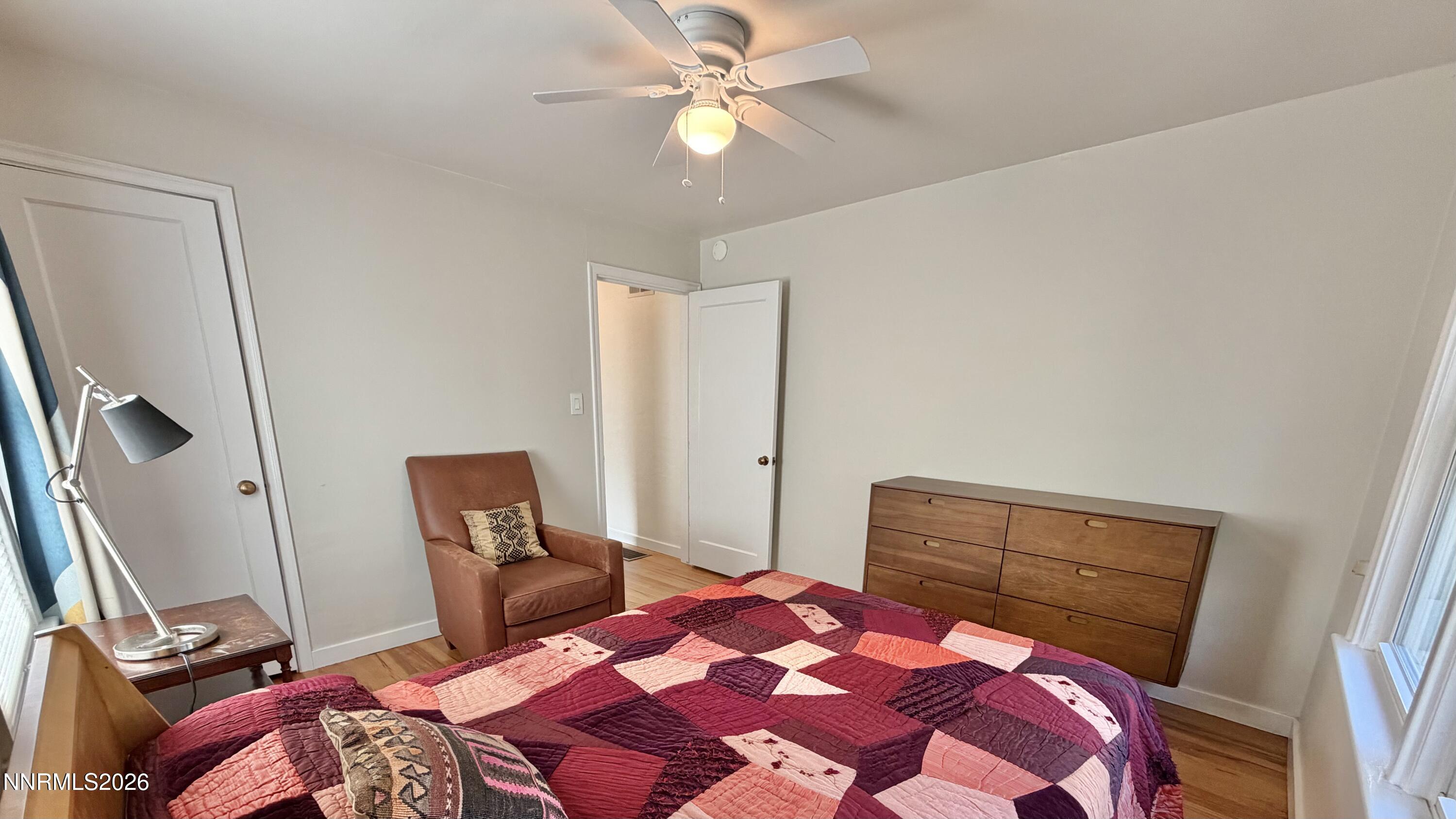 525 East Taylor Street Reno, NV 89502 - Photo 14 of 30 a bedroom with a bed and a lamp with the dresser