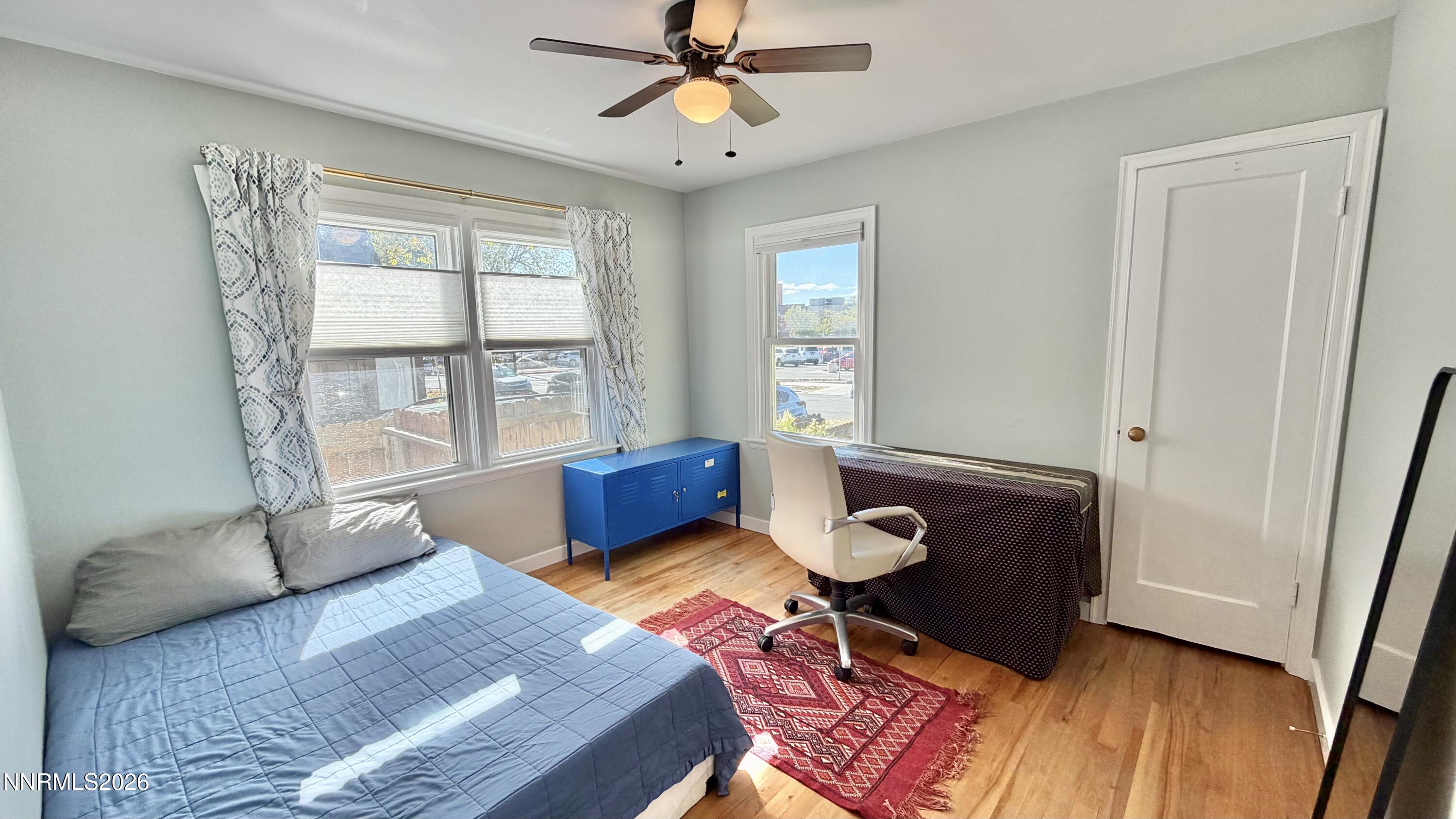 525 East Taylor Street Reno, NV 89502 - Photo 17 of 30 a bedroom with a bed and wooden floor