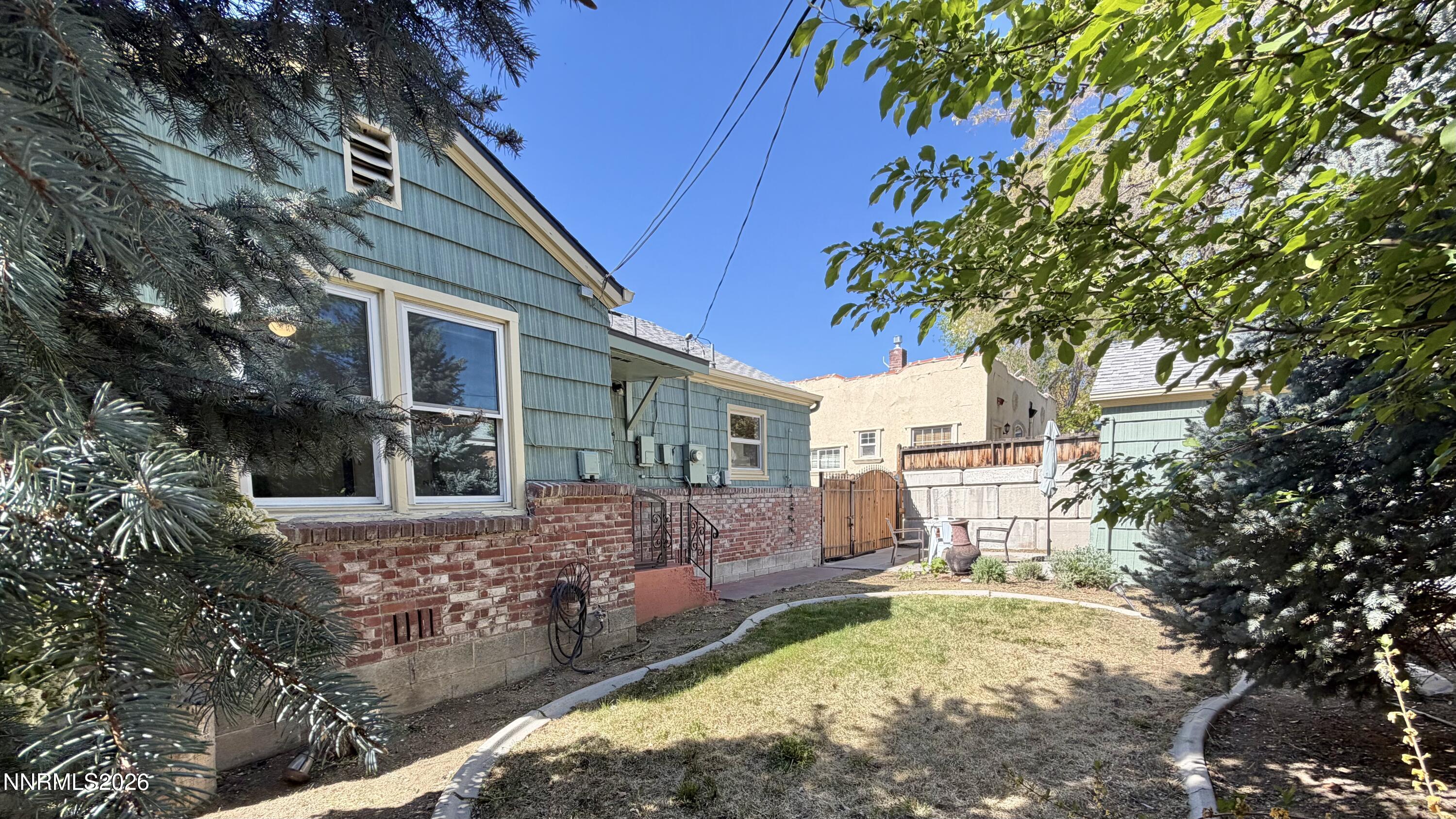525 East Taylor Street Reno, NV 89502 - Photo 26 of 30 a view of a yard with plants and a large tree