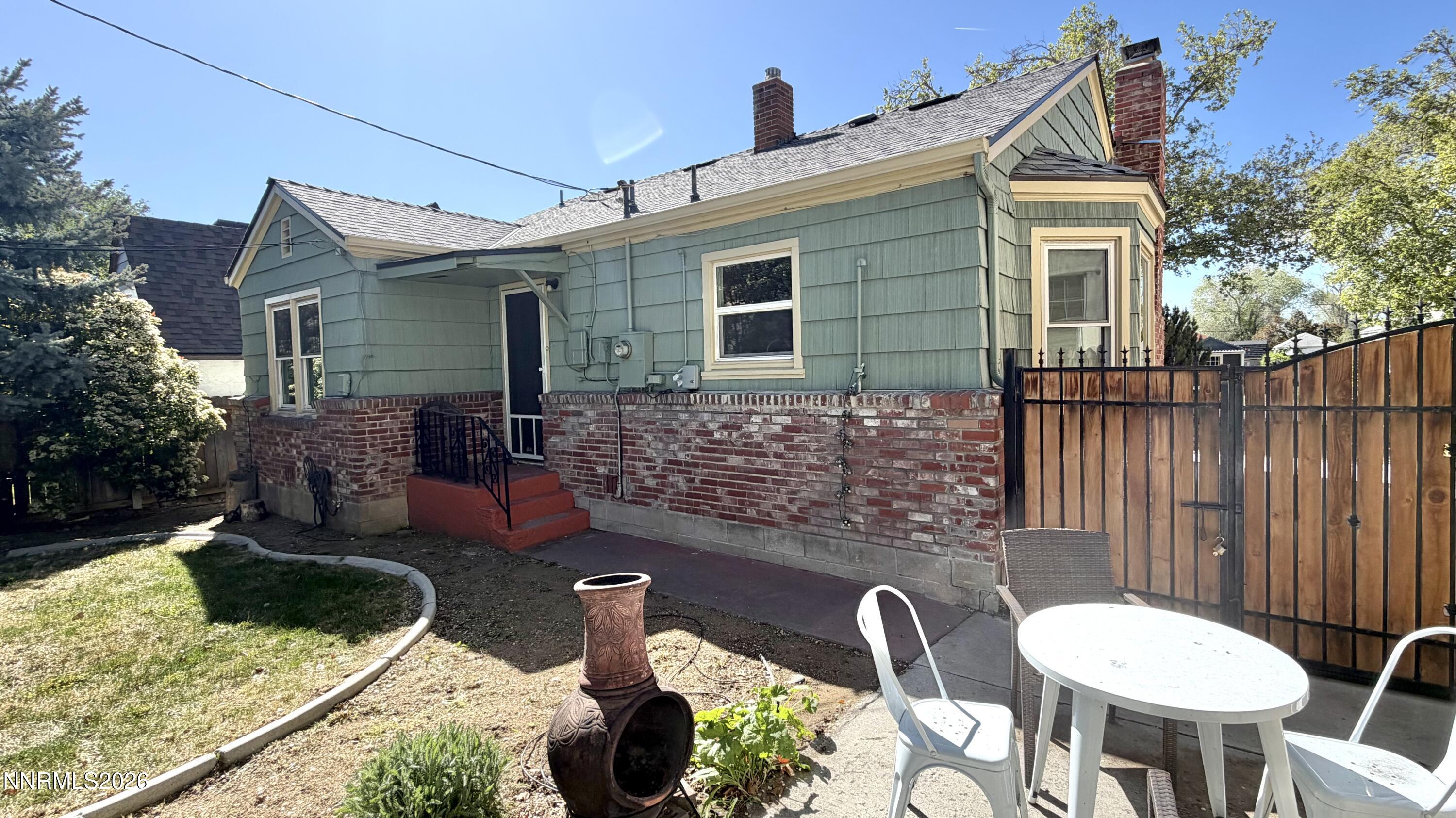 525 East Taylor Street Reno, NV 89502 - Photo 28 of 30 a backyard of a house with fire pit and outdoor seating