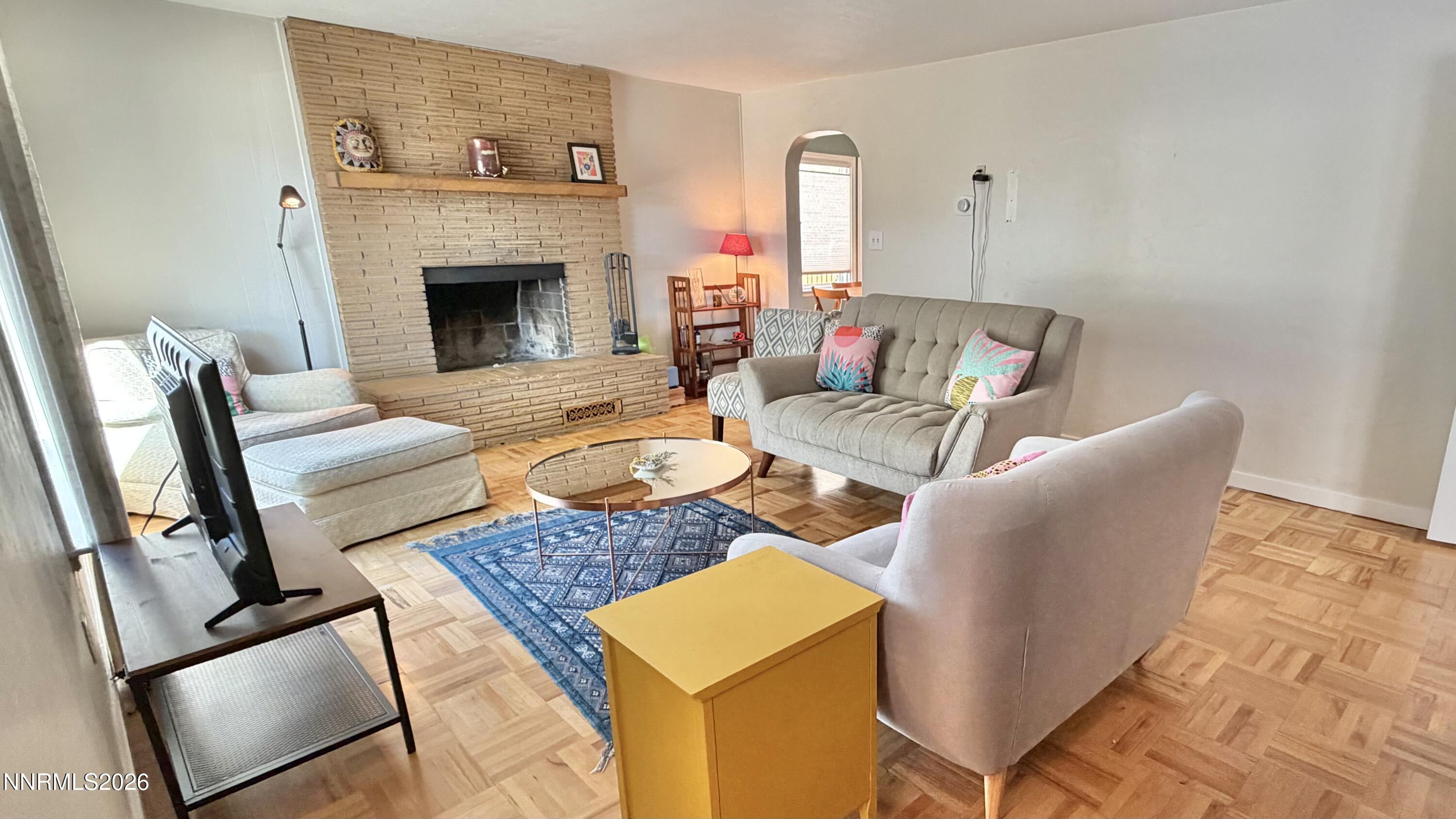 525 East Taylor Street Reno, NV 89502 - Photo 4 of 30 a living room with furniture and a fireplace