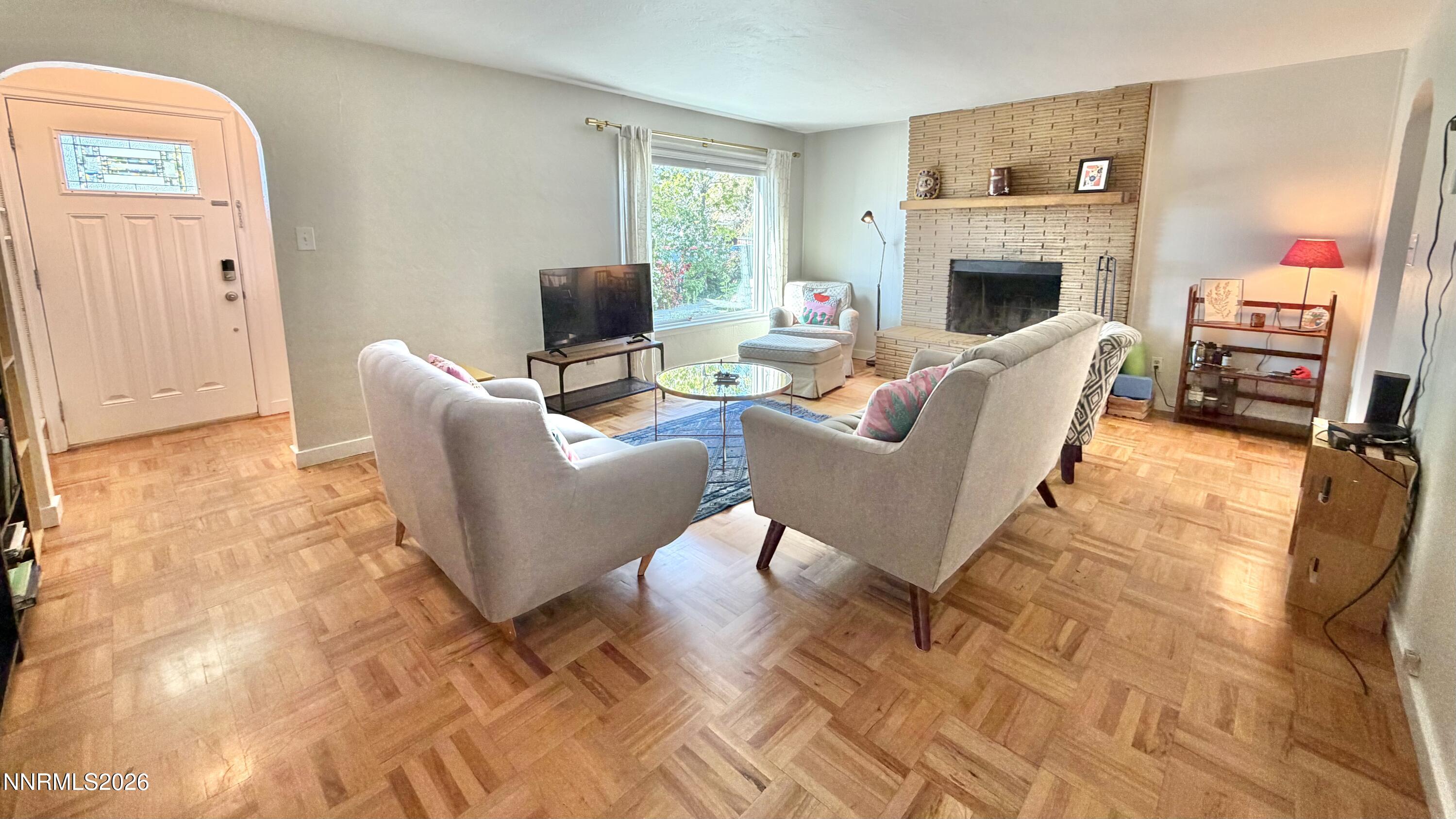 525 East Taylor Street Reno, NV 89502 - Photo 5 of 30 a living room with furniture and a fireplace