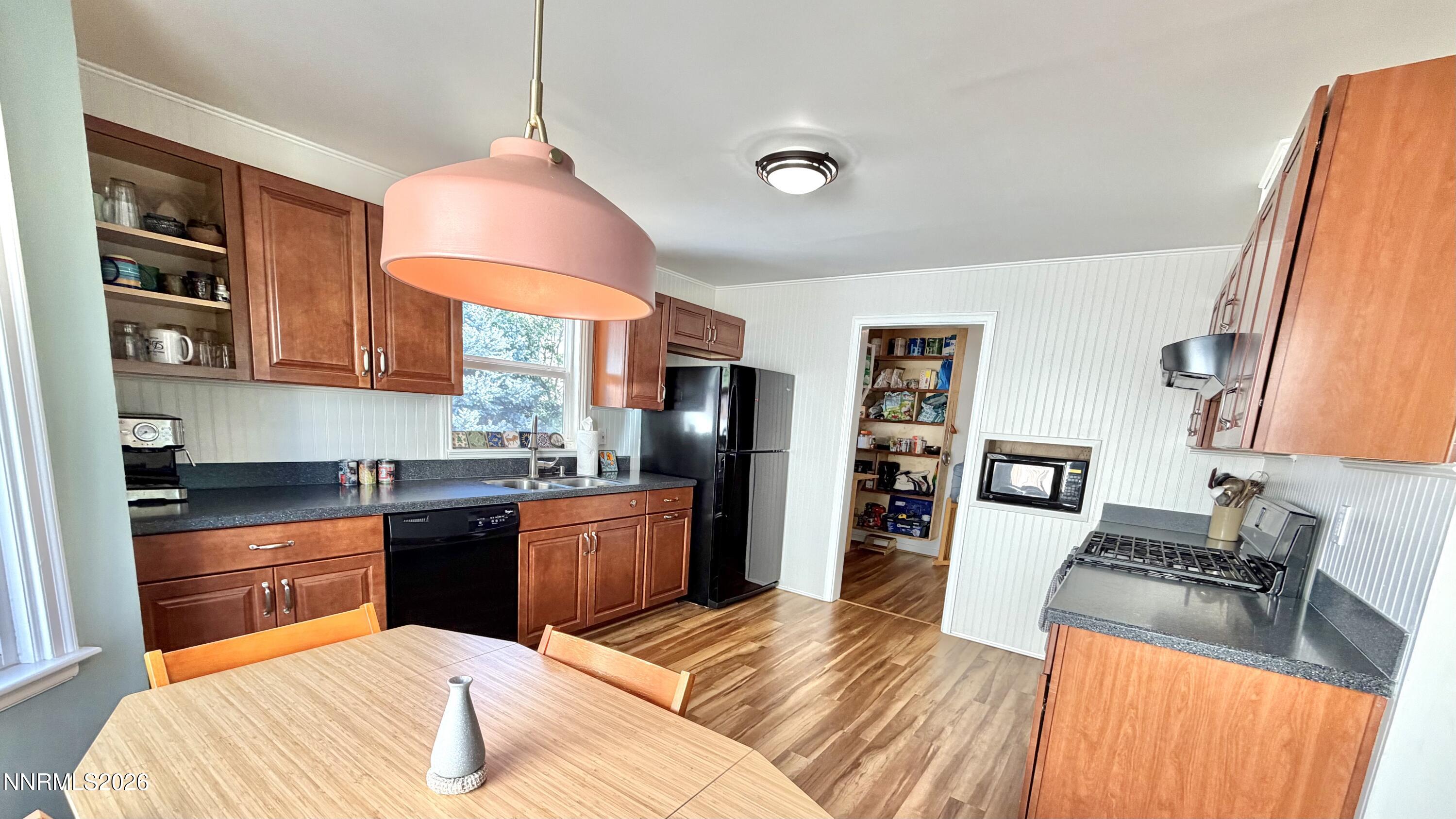 525 East Taylor Street Reno, NV 89502 - Photo 9 of 30 a kitchen with stainless steel appliances granite countertop a sink dishwasher stove and refrigerator