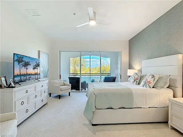 a bathroom with a double vanity sink mirror and bathtub