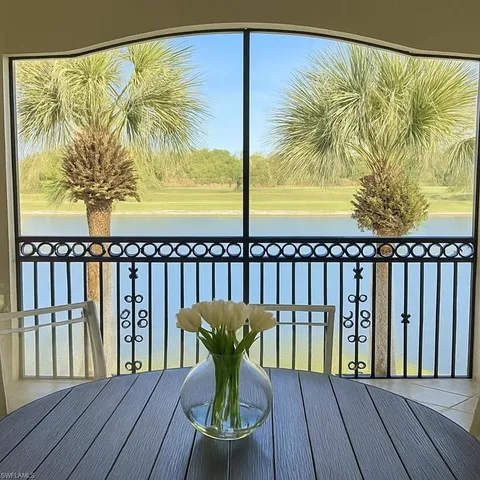 a bedroom with a table and a chair