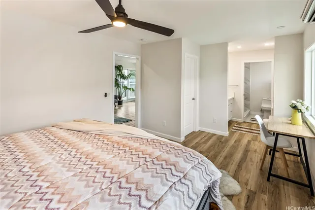 a bedroom with a bed and a table in it