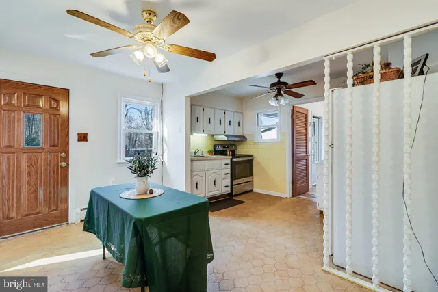 a view of kitchen with furniture and wooden floor