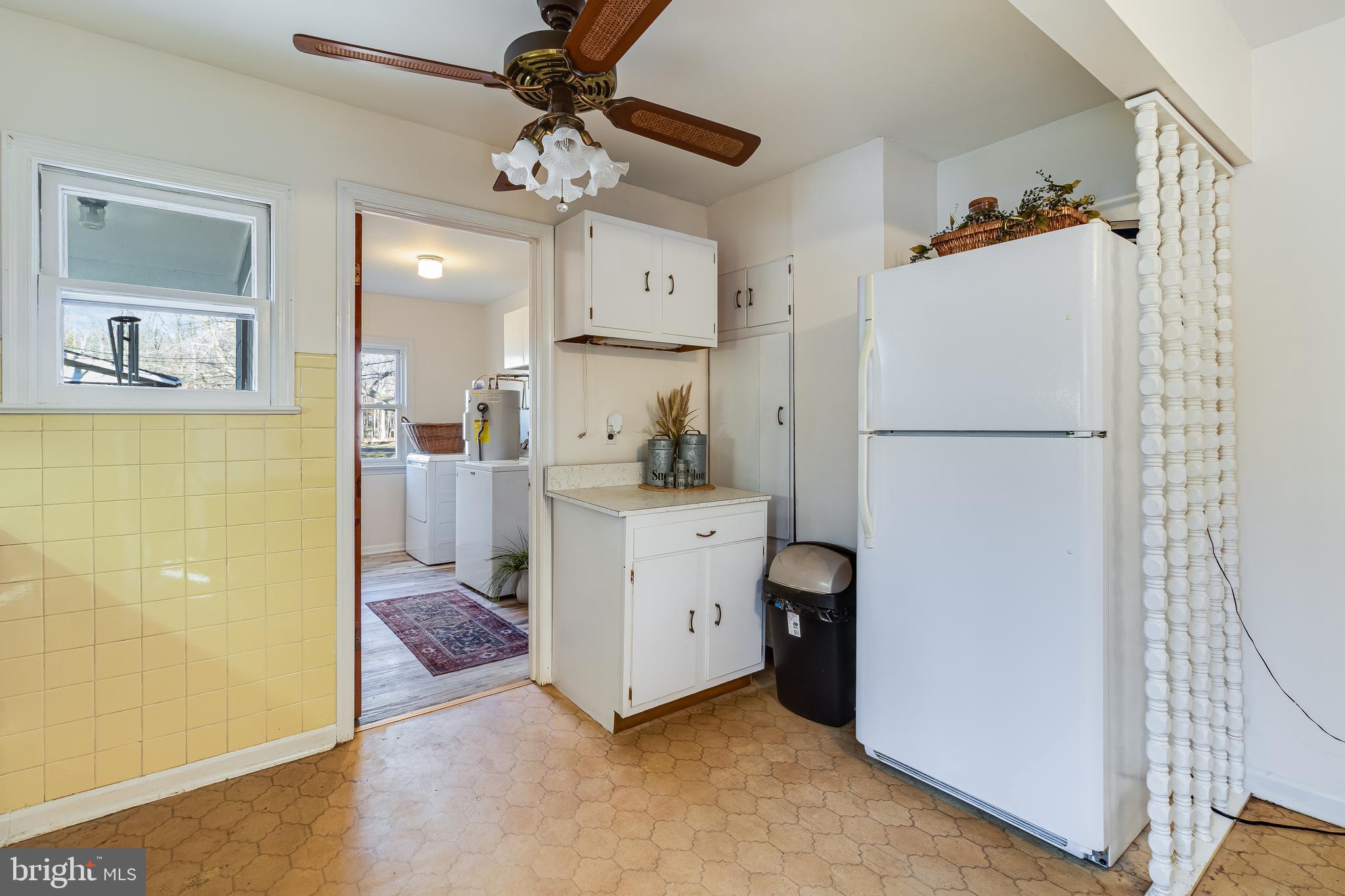 965 Franklin Manor Road Churchton, MD 20733 - Photo 15 of 34 a kitchen with a refrigerator and a stove
