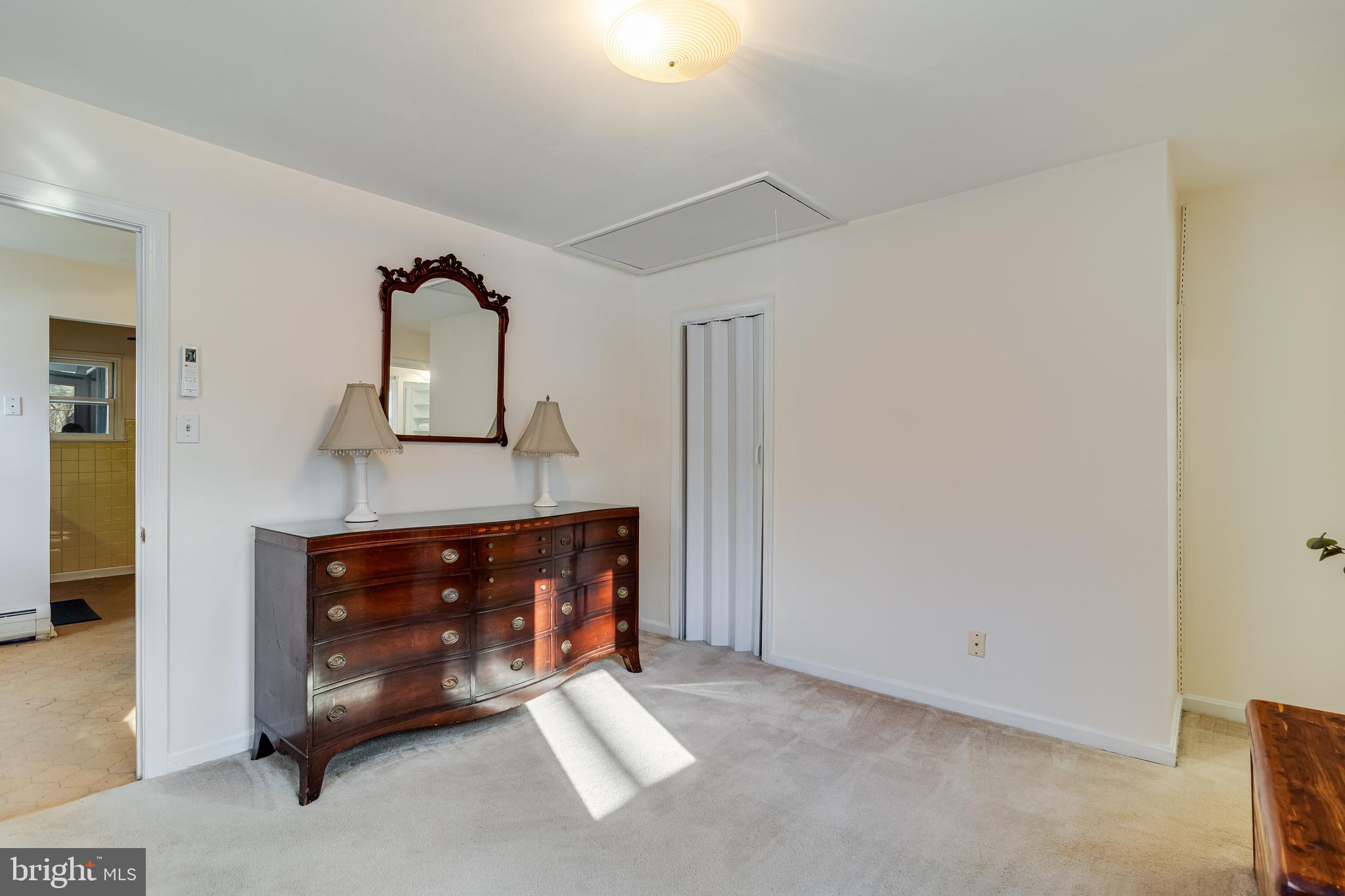 965 Franklin Manor Road Churchton, MD 20733 - Photo 6 of 34 a room with a fireplace and a mirror