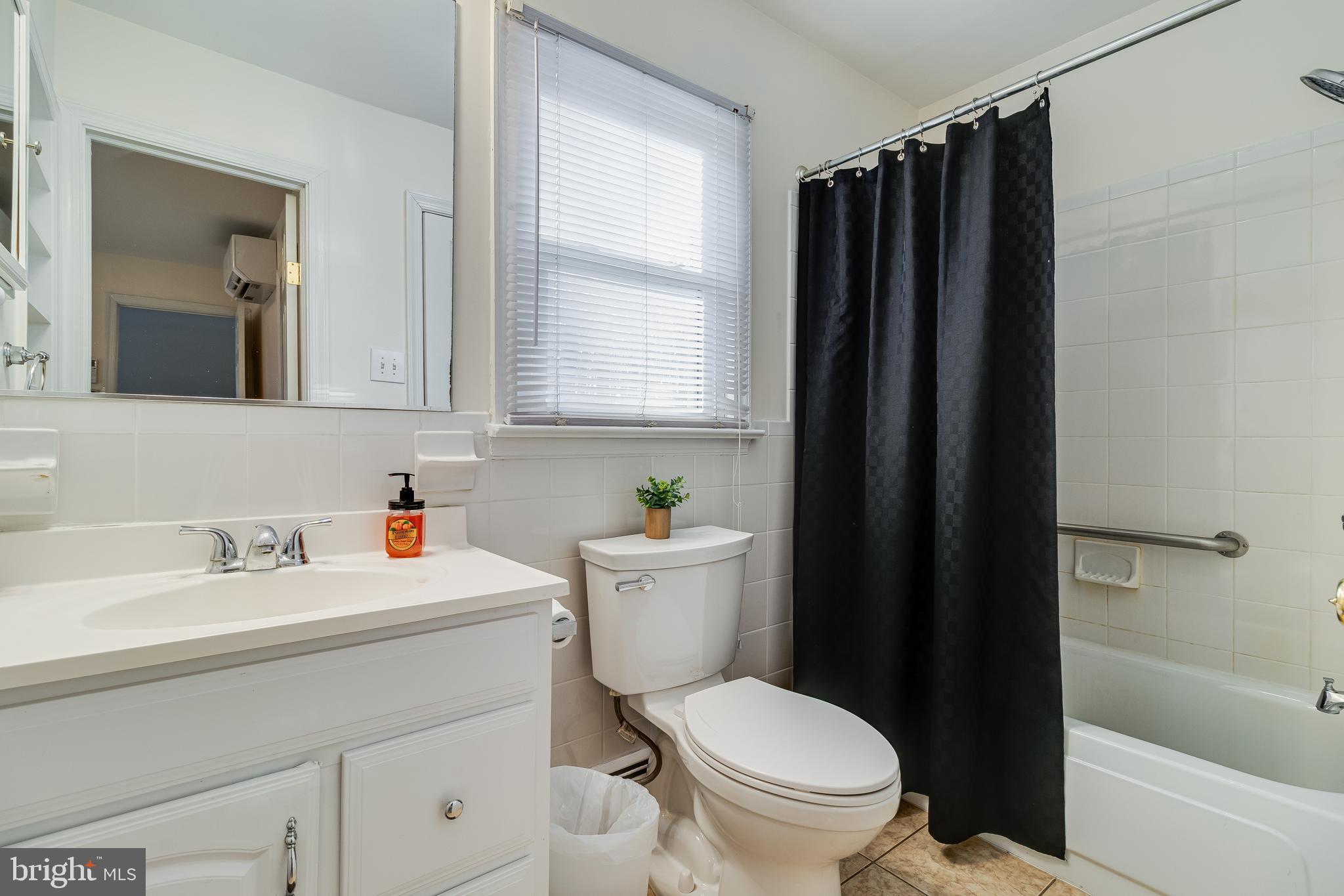 965 Franklin Manor Road Churchton, MD 20733 - Photo 7 of 34 a bathroom with a sink a toilet and shower