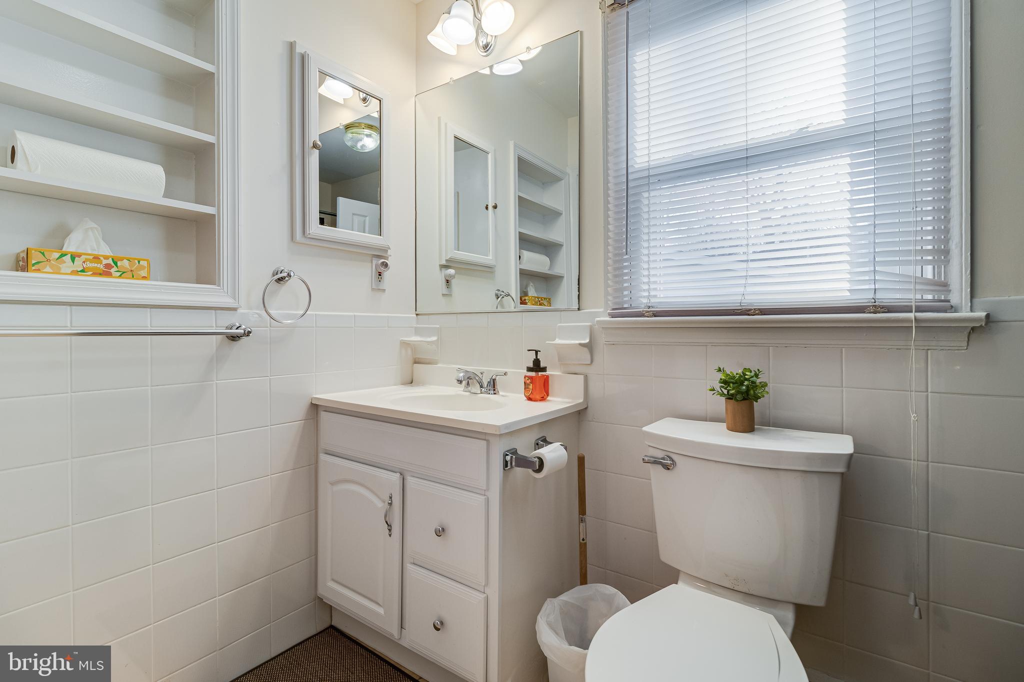 965 Franklin Manor Road Churchton, MD 20733 - Photo 8 of 34 a bathroom with a sink a toilet and a window