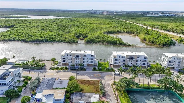 an aerial view of a city with a lake view