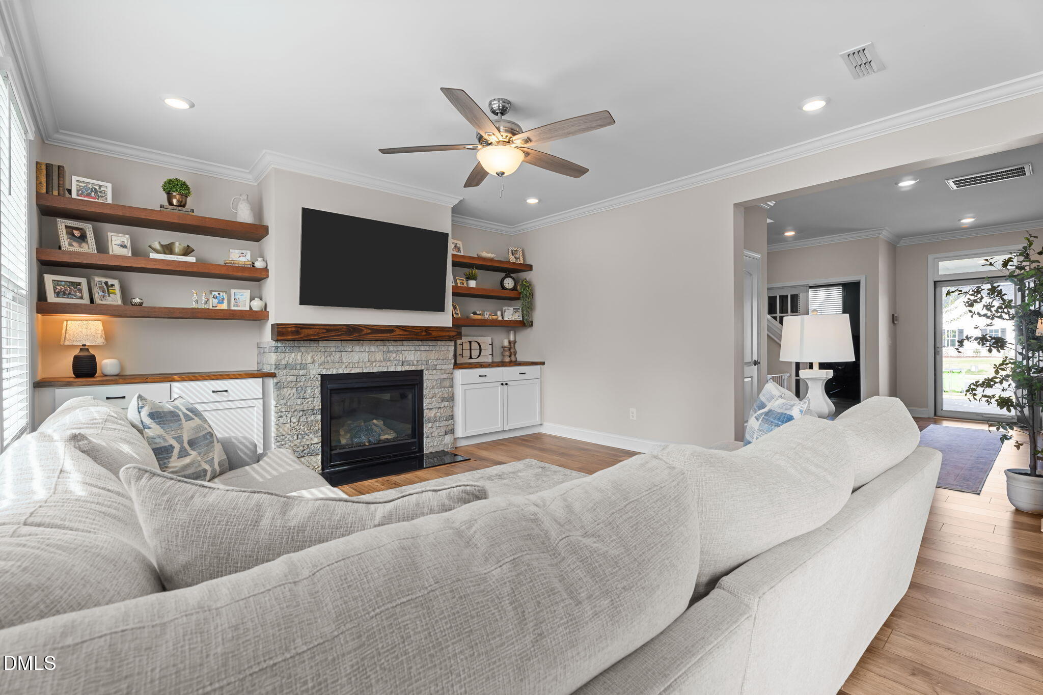 145 Shadowdale Lane Rolesville, NC 27571 - Photo 14 of 43 a living room with furniture a flat screen tv and a fireplace