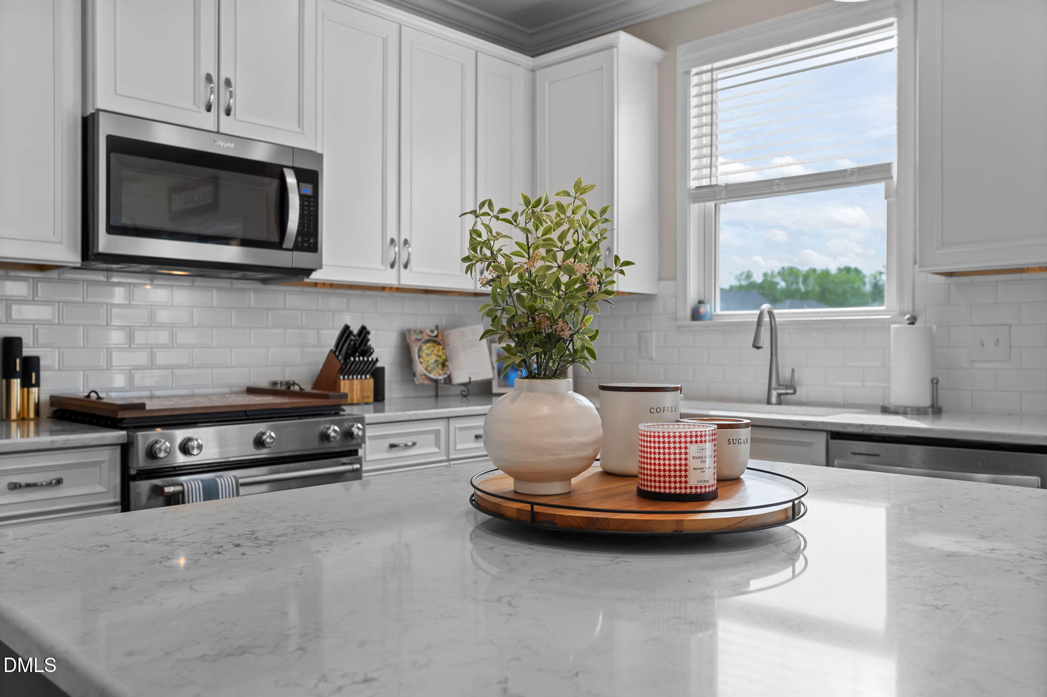 145 Shadowdale Lane Rolesville, NC 27571 - Photo 17 of 43 a kitchen with a stove and a microwave