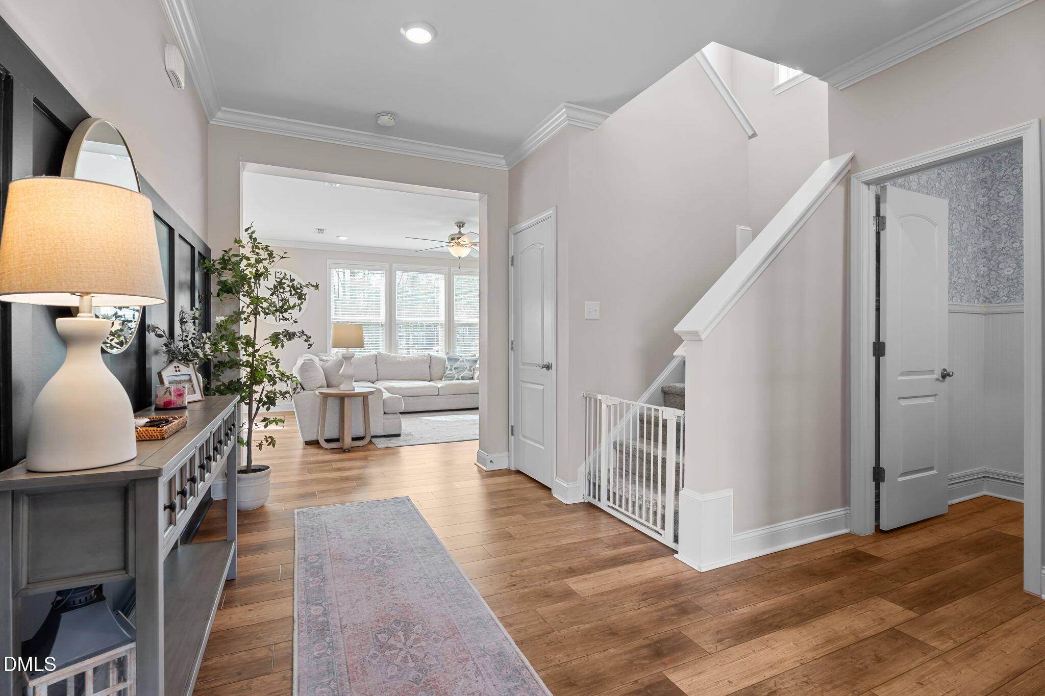 145 Shadowdale Lane Rolesville, NC 27571 - Photo 2 of 43 a view of a hallway with wooden floor windows and a livingroom