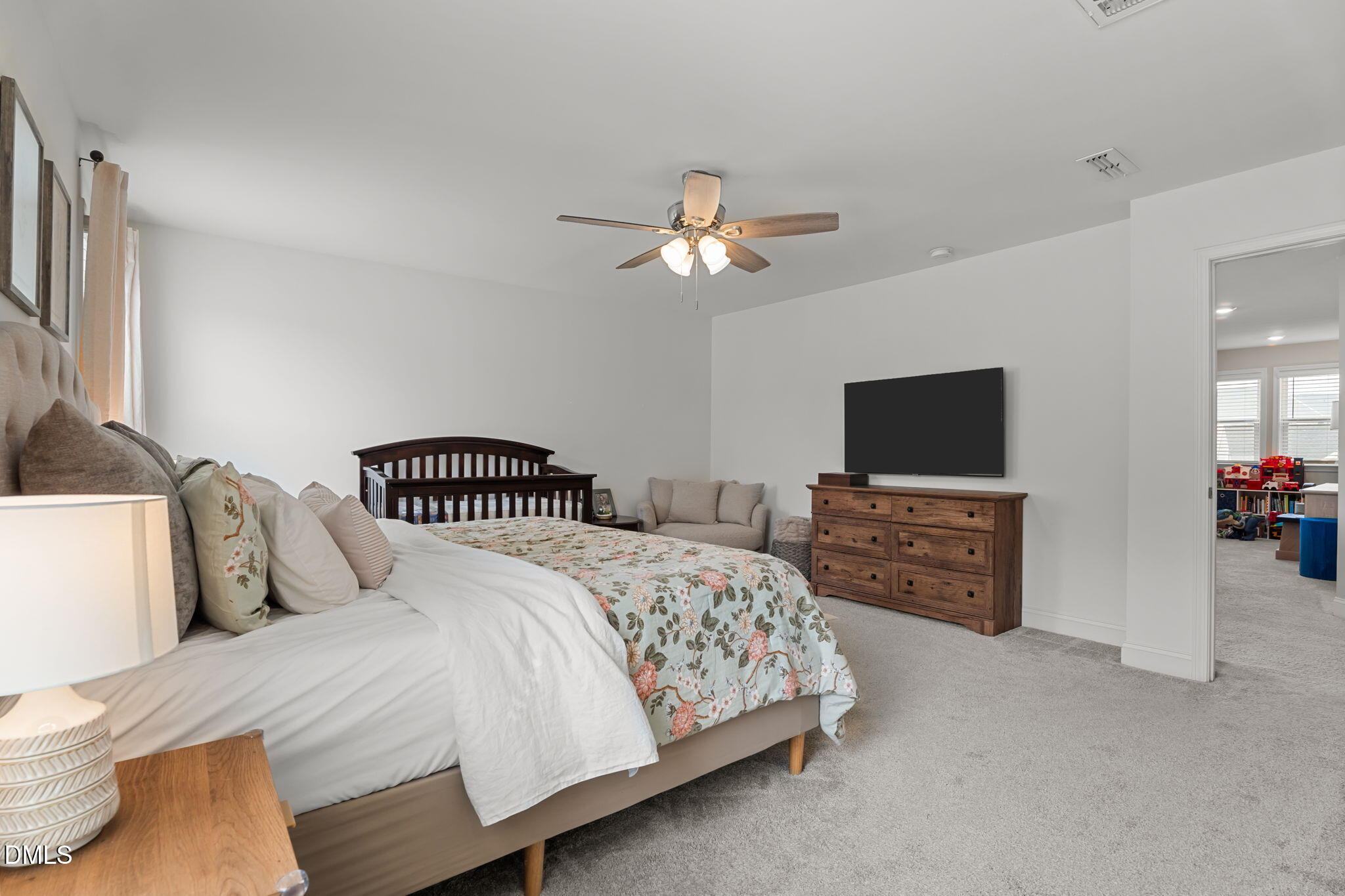145 Shadowdale Lane Rolesville, NC 27571 - Photo 21 of 43 a bedroom with a bed and a flat screen tv