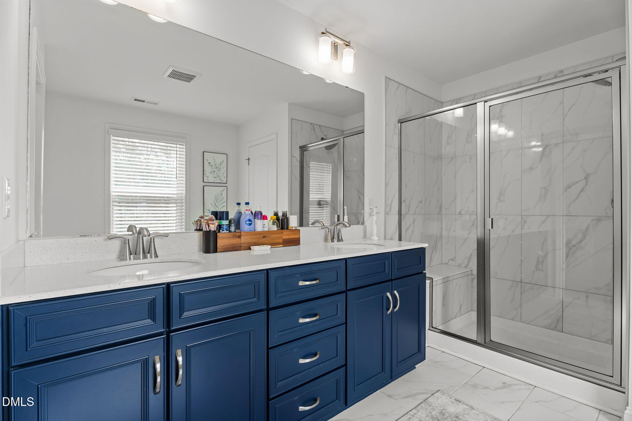 145 Shadowdale Lane Rolesville, NC 27571 - Photo 22 of 43 a bathroom with double vanity sink and a mirror